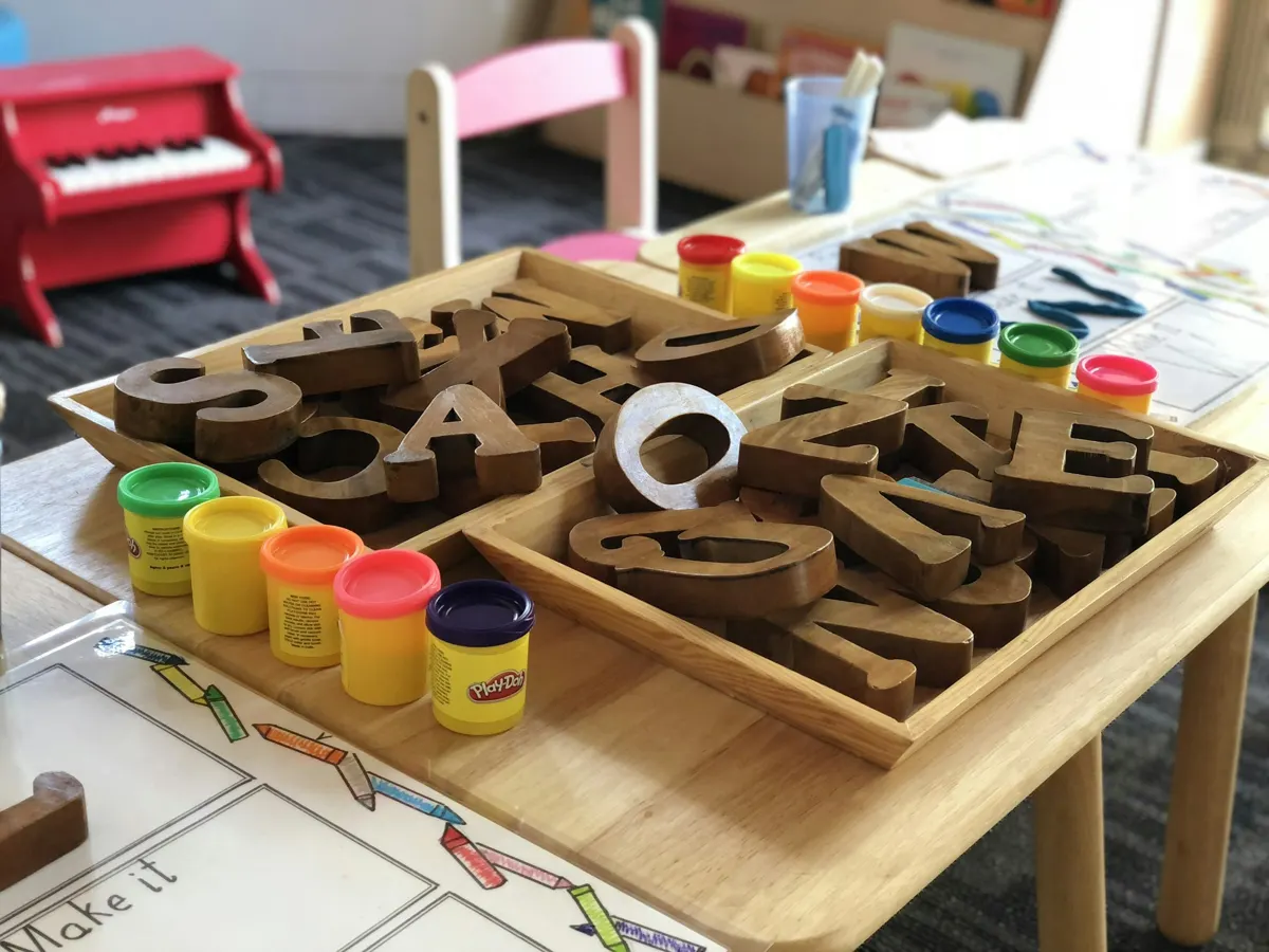 Wooden letters and play dough
